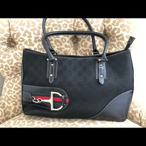 Black canvas logo Gucci-style handbag